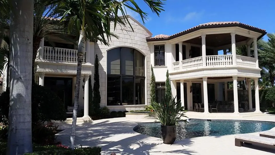 Two-story home with pool after an exterior repaint