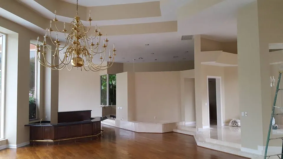 Grand living space with high ceilings after painting
