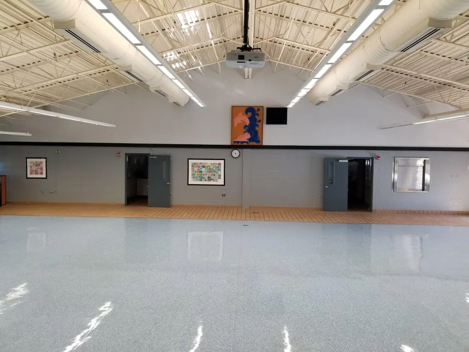 Large gym floor finished with a clean white coating